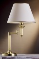 Złota lampa nocna z regulowanym ramieniem.  Lampka nocna do pokoi hotelowych i apartamentów w stylu glamour.