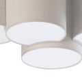 Lampa na sufit składająca się z 4 geometrycznych abażurów w kolorze beżowo - szarym.